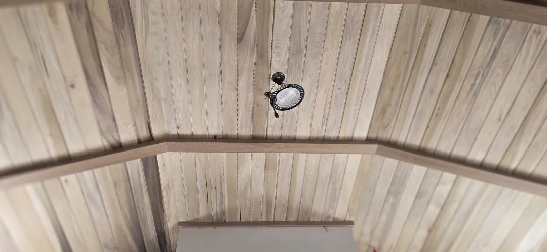 Wide view of the completed sweep and grain variation in the curved oak ceiling.