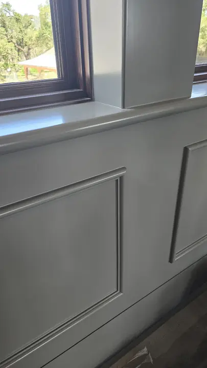 Painted paneled wall and detailed window surround at the Stoneridge project.